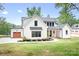 Stunning two-story home with a manicured lawn and modern farmhouse architectural details at 106 Arbor Dr, Waxhaw, NC 28173