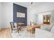 Cozy living room featuring a modern fireplace, hardwood floors, comfortable seating, and an open floor plan at 106 Arbor Dr, Waxhaw, NC 28173