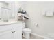 Upstairs bathroom features a single sink vanity, toilet, and a shower tub with a storage rack at 109 Mac Aly, Cramerton, NC 28032