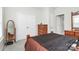 Bedroom features dark and brown decor, along with a dresser, large mirror, and neutral walls and carpet at 109 Mac Aly, Cramerton, NC 28032