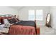 Comfortable bedroom features a well-made bed with a dark and brown comforter, along with matching decor at 109 Mac Aly, Cramerton, NC 28032