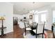 Open dining area with modern chandelier and connecting to the kitchen at 109 Mac Aly, Cramerton, NC 28032