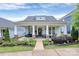 Charming single-story home with a covered front porch, stone accents, and landscaped yard at 109 Mac Aly, Cramerton, NC 28032