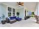 Spacious front porch with ceiling fan and cozy blue sectional sofa at 109 Mac Aly, Cramerton, NC 28032