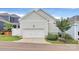 Attached one-car garage showcasing a neutral color, with a well-maintained lawn and landscaping at 109 Mac Aly, Cramerton, NC 28032