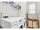 Bright laundry room featuring a Whirlpool washer/dryer set, wire shelving, and a window for natural light at 109 Mac Aly, Cramerton, NC 28032