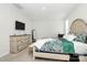Comfortable main bedroom with ensuite features a queen bed, neutral walls, and updated dresser at 109 Mac Aly, Cramerton, NC 28032