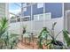 Enclosed patio area with plants, seating, and a small table, creating a relaxing outdoor space at 109 Mac Aly, Cramerton, NC 28032