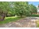 The large backyard has a shed, basketball court, and mature trees at 114 Sardis Plantation Dr, Matthews, NC 28105