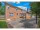 An exterior view of the brick home with a large concrete patio at 114 Sardis Plantation Dr, Matthews, NC 28105