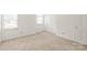This bedroom has neutral carpet, a closet, and natural light from two windows at 114 Sardis Plantation Dr, Matthews, NC 28105