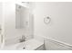 Clean powder room with a modern sink, sleek faucet, and a round towel rack, showcasing minimalist design at 114 Sardis Plantation Dr, Matthews, NC 28105