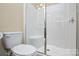 Clean bathroom showcasing a shower with a glass door at 11607 Meetinghouse Dr, Cornelius, NC 28031