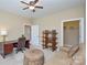 Cozy bedroom featuring a ceiling fan, carpeted floor and a large comfortable sofa at 11607 Meetinghouse Dr, Cornelius, NC 28031