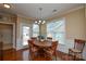 Charming dining area with hardwood floors, and a decorative chandelier at 11607 Meetinghouse Dr, Cornelius, NC 28031