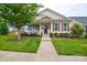 Charming single-Gathering home featuring a well-manicured lawn, walkway, shrubs, and inviting front porch at 11607 Meetinghouse Dr, Cornelius, NC 28031