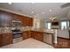 Modern kitchen with stainless steel appliances, granite countertops, tile backsplash, and ample cabinet space at 11607 Meetinghouse Dr, Cornelius, NC 28031