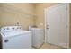Functional laundry room with modern washer and dryer units, ready for use at 11607 Meetinghouse Dr, Cornelius, NC 28031