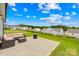 Inviting backyard patio with comfortable seating and a fire pit overlooking green space at 130 Slalom St, Statesville, NC 28677