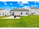 Lush backyard with a patio, comfortable seating, and a fire pit for relaxing evenings at 130 Slalom St, Statesville, NC 28677