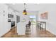 Open-concept kitchen featuring an island with barstool seating and stainless steel appliances at 130 Slalom St, Statesville, NC 28677