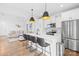 Modern kitchen with white cabinets, stainless steel appliances, and a spacious island with seating at 130 Slalom St, Statesville, NC 28677