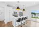 Stylish kitchen with a large island, barstool seating, and modern lighting fixtures at 130 Slalom St, Statesville, NC 28677