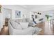 Open-concept living room flowing into the kitchen with stylish furniture and wood flooring at 130 Slalom St, Statesville, NC 28677