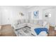Bright living room with a large sectional sofa, modern decor, and wood flooring at 130 Slalom St, Statesville, NC 28677