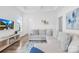 Cozy living room featuring a large sectional sofa, wooden floors, and a TV set at 130 Slalom St, Statesville, NC 28677