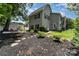 Backyard with a basketball court, an outdoor seating area, a brick path, and lush landscaping at 141 Eastover Se Dr, Concord, NC 28025