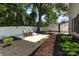 Backyard with a basketball court, an outdoor seating area, a brick path, and a privacy fence at 141 Eastover Se Dr, Concord, NC 28025
