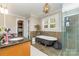 Elegant bathroom featuring a clawfoot tub, walk in shower, and stylish vanity at 141 Eastover Se Dr, Concord, NC 28025