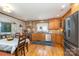 Spacious eat in kitchen featuring stainless steel appliances, wood cabinets and hardwood floors at 141 Eastover Se Dr, Concord, NC 28025