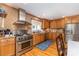 Well-equipped kitchen featuring stainless steel appliances, wood cabinets, and granite countertops at 141 Eastover Se Dr, Concord, NC 28025