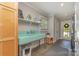 Laundry room with vintage sink, gray tile floors, modern washer, and open shelving at 141 Eastover Se Dr, Concord, NC 28025
