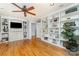 Spacious living room with hardwood floors and built-in shelving for ample storage and display at 141 Eastover Se Dr, Concord, NC 28025