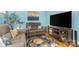 Comfortable living room with plush seating, colorful rug, and large screen TV at 141 Eastover Se Dr, Concord, NC 28025