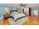 Serene main bedroom featuring a ceiling fan, hardwood floors and adjacent desk/office area at 141 Eastover Se Dr, Concord, NC 28025
