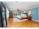 Tranquil main bedroom with hardwood floors, a ceiling fan and natural light at 141 Eastover Se Dr, Concord, NC 28025