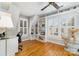 Comfortable home office with natural light, hardwood floors and custom built-in shelving at 141 Eastover Se Dr, Concord, NC 28025