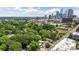 Aerial view of the city skyline with dense trees in foreground at 1620 S Tryon St, Charlotte, NC 28203