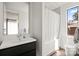 Contemporary bathroom with modern vanity, sleek fixtures, and a bathtub shower combo with a white curtain at 1620 S Tryon St, Charlotte, NC 28203