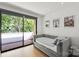 Cozy bedroom featuring a comfortable bed, bright natural light from the oversized sliding doors to deck at 1620 S Tryon St, Charlotte, NC 28203
