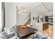 Open concept dining room featuring modern lighting, stylish seating, and hardwood floors at 1620 S Tryon St, Charlotte, NC 28203