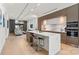 Modern kitchen boasts stainless steel appliances, waterfall island, and an open floor plan at 1620 S Tryon St, Charlotte, NC 28203
