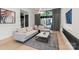 Bright living room featuring modern décor, a fireplace, and access to outdoor space at 1620 S Tryon St, Charlotte, NC 28203