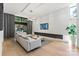 Contemporary living area featuring stylish furniture, a fireplace, and access to outdoor space at 1620 S Tryon St, Charlotte, NC 28203