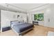 Bright main bedroom with a window seat, modern lighting, and ample storage offers a luxurious and comfortable space at 1620 S Tryon St, Charlotte, NC 28203