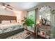 Inviting bedroom featuring a stylish bed, large window, and elegant decor at 1804 Fairlawn Ct, Rock Hill, SC 29732